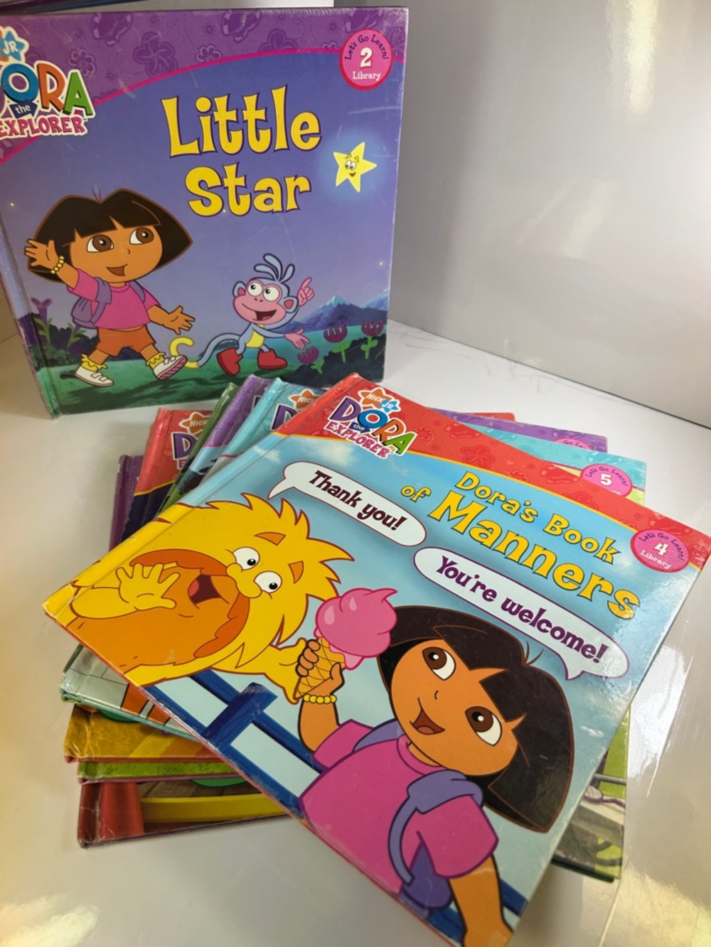 Dora the Explorer (8 Book Lot — 2, 4, 5, 7, 8, 9, 11, & 12). Hardcover